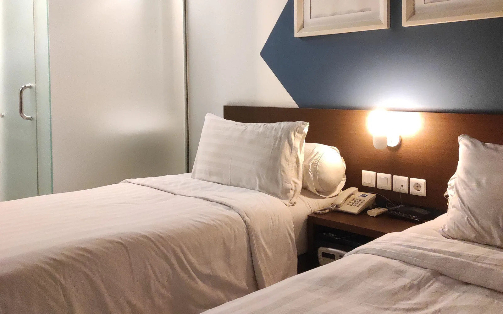 Illustrative hotel room with two single beds