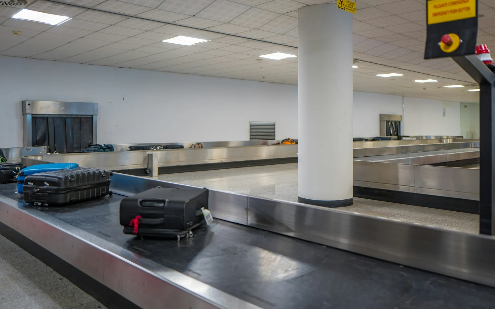 Luggage moving around an airport baggage carousel
