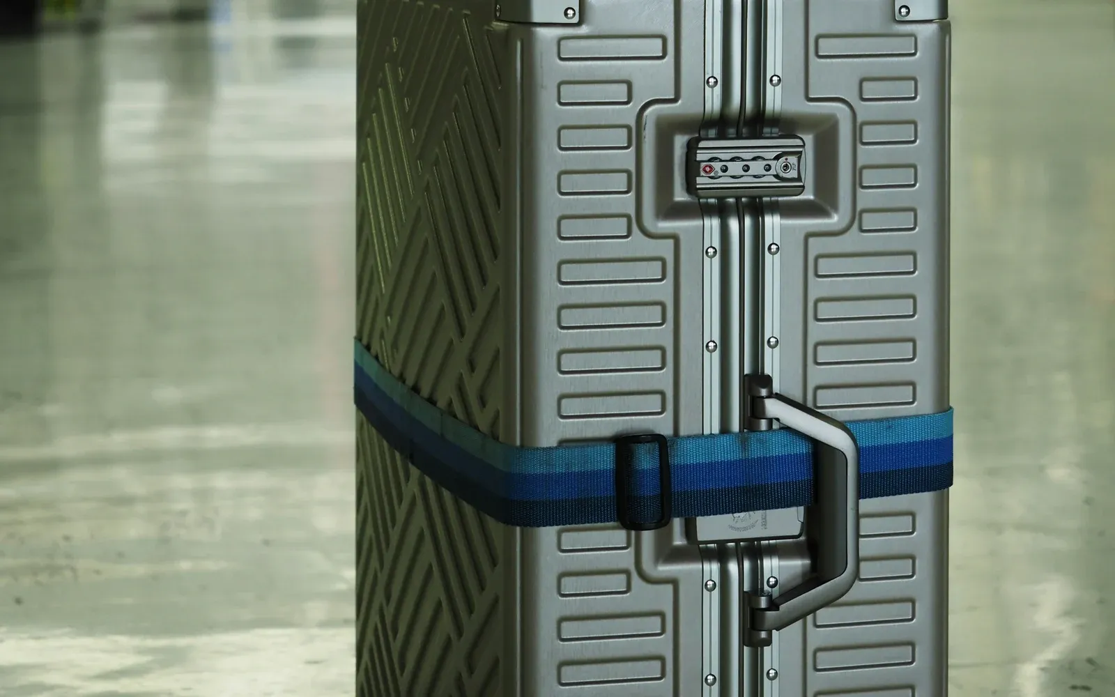 A suitcase waiting inside an airport terminal