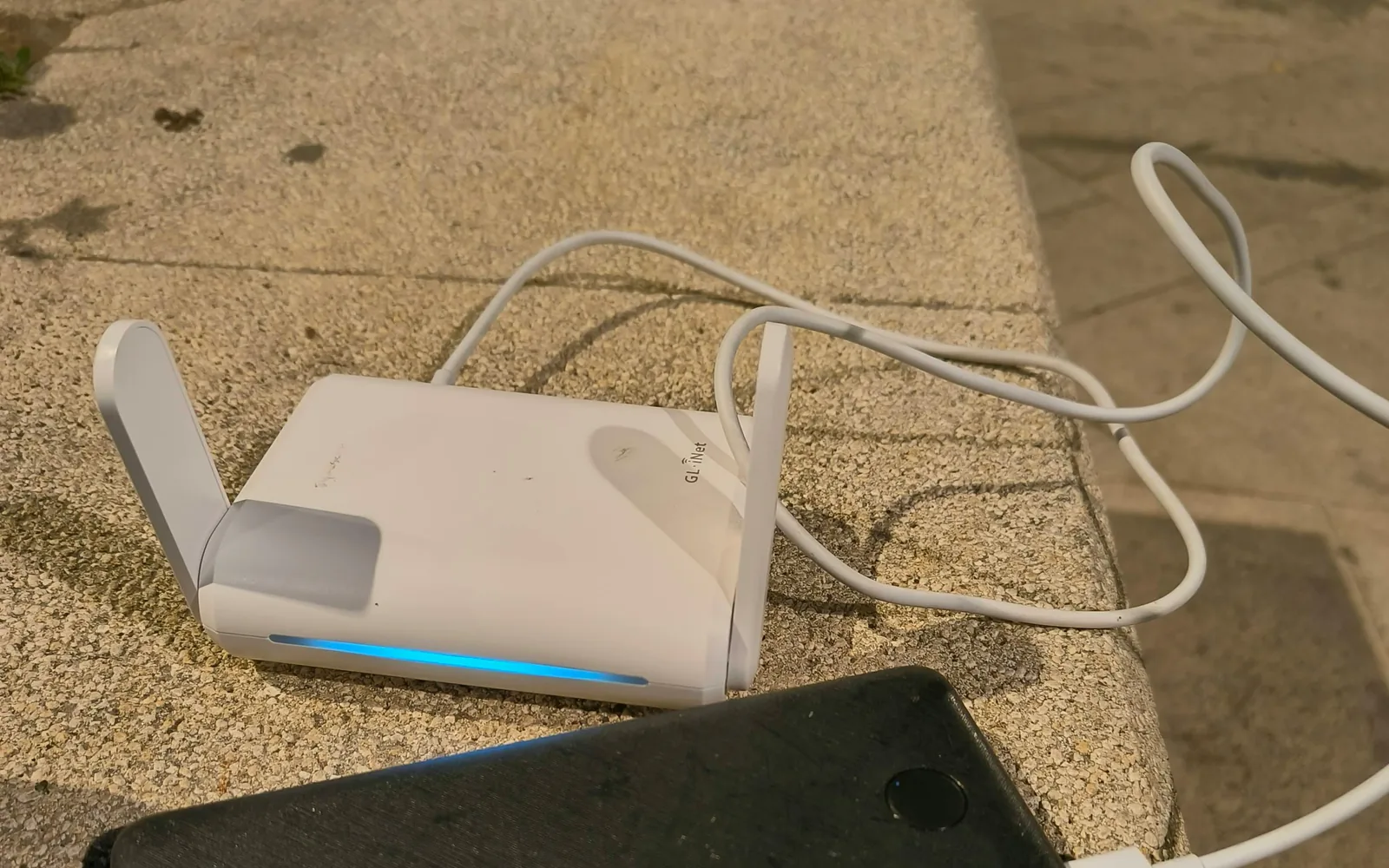 Portable travel router connected to a power bank