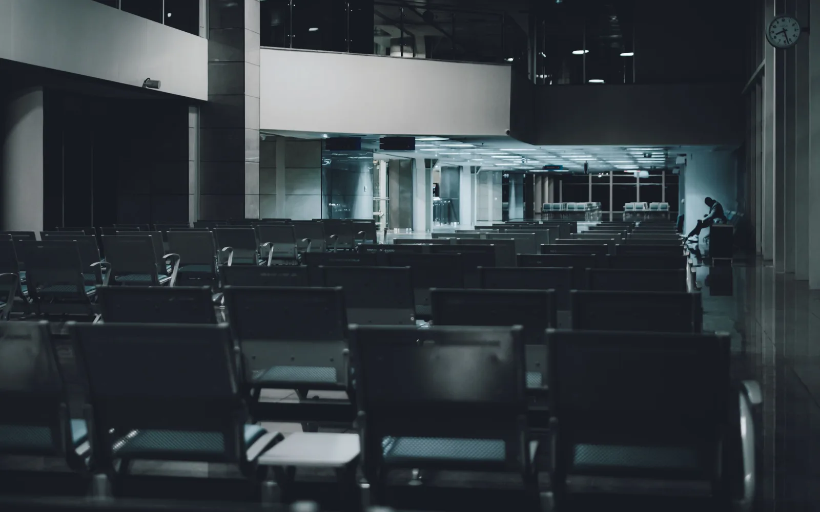 Illustrative dark airport waiting area