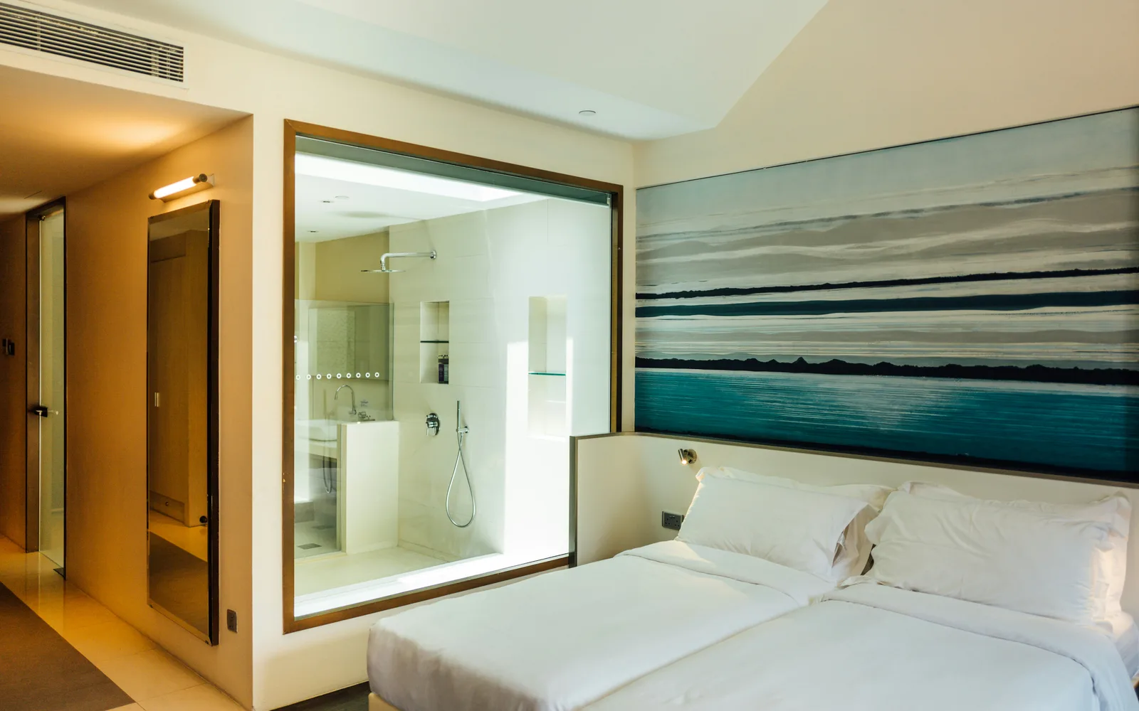 Illustrative hotel room with two beds and a shower