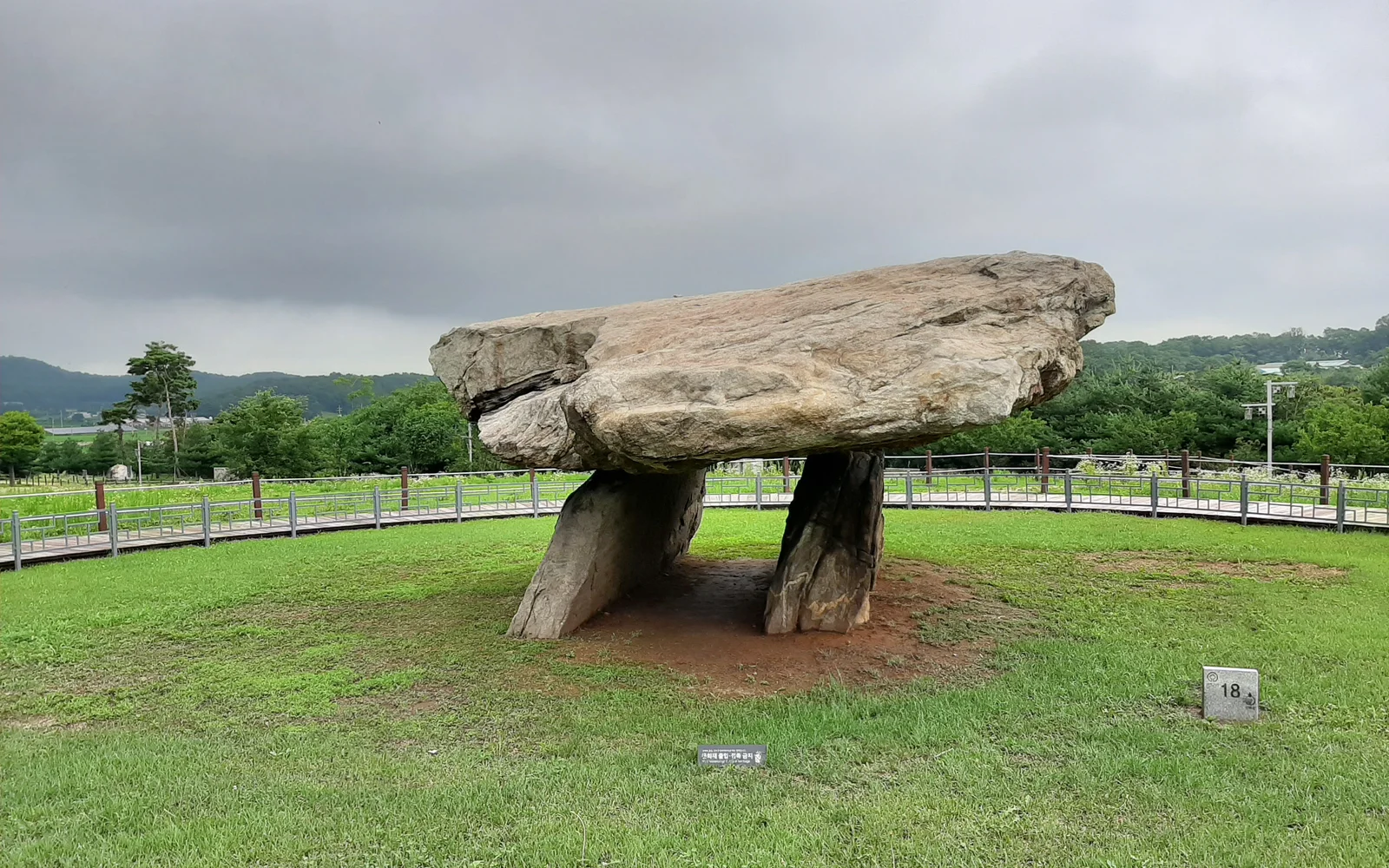 Large table-shaped dolmen on a grassy archaeological site on Ganghwa Island