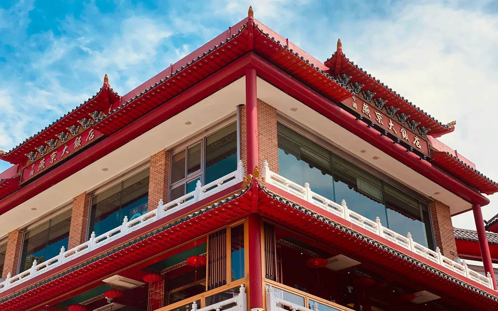Red-roofed Chinese-style building beneath a blue sky in Incheon Chinatown