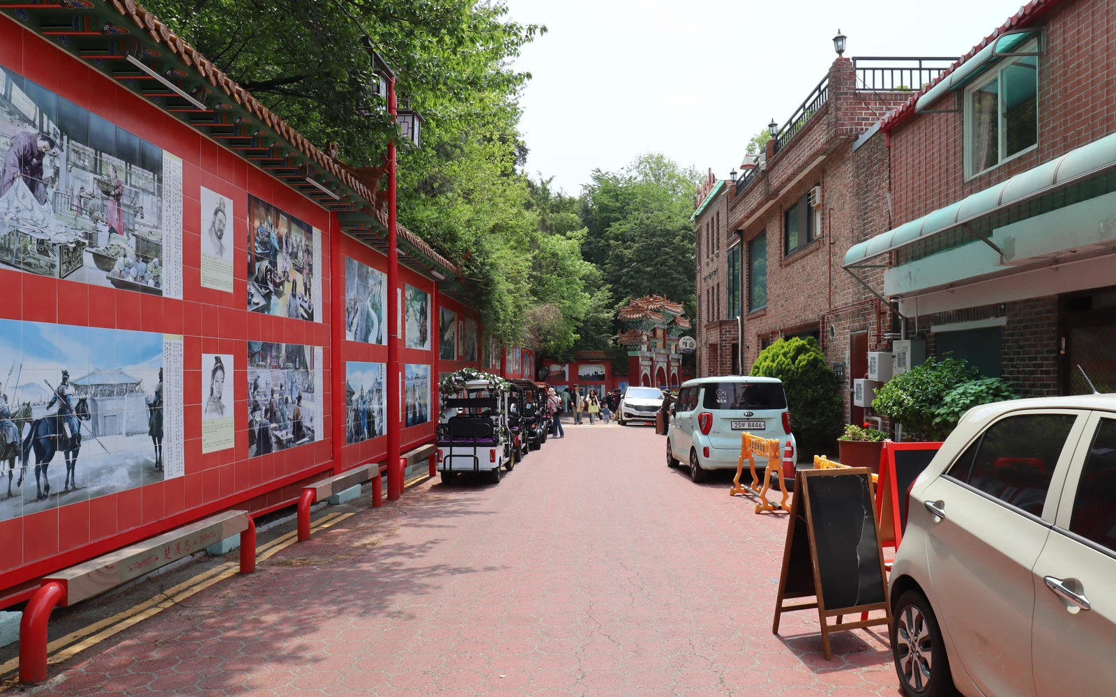 Red Samgukji mural street leading uphill through Incheon Chinatown